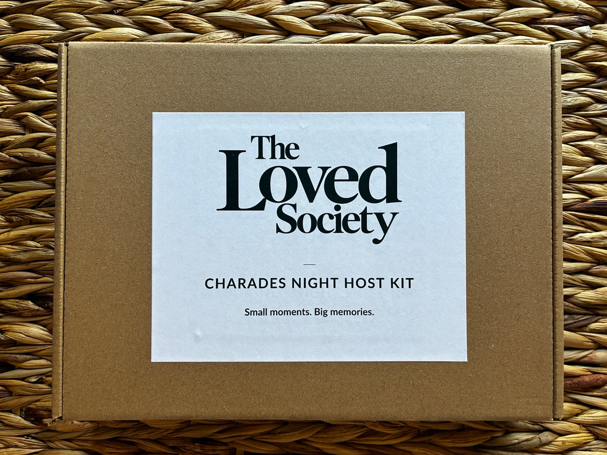 Closed brown Charades Night Host Kit box with The Loved Society label